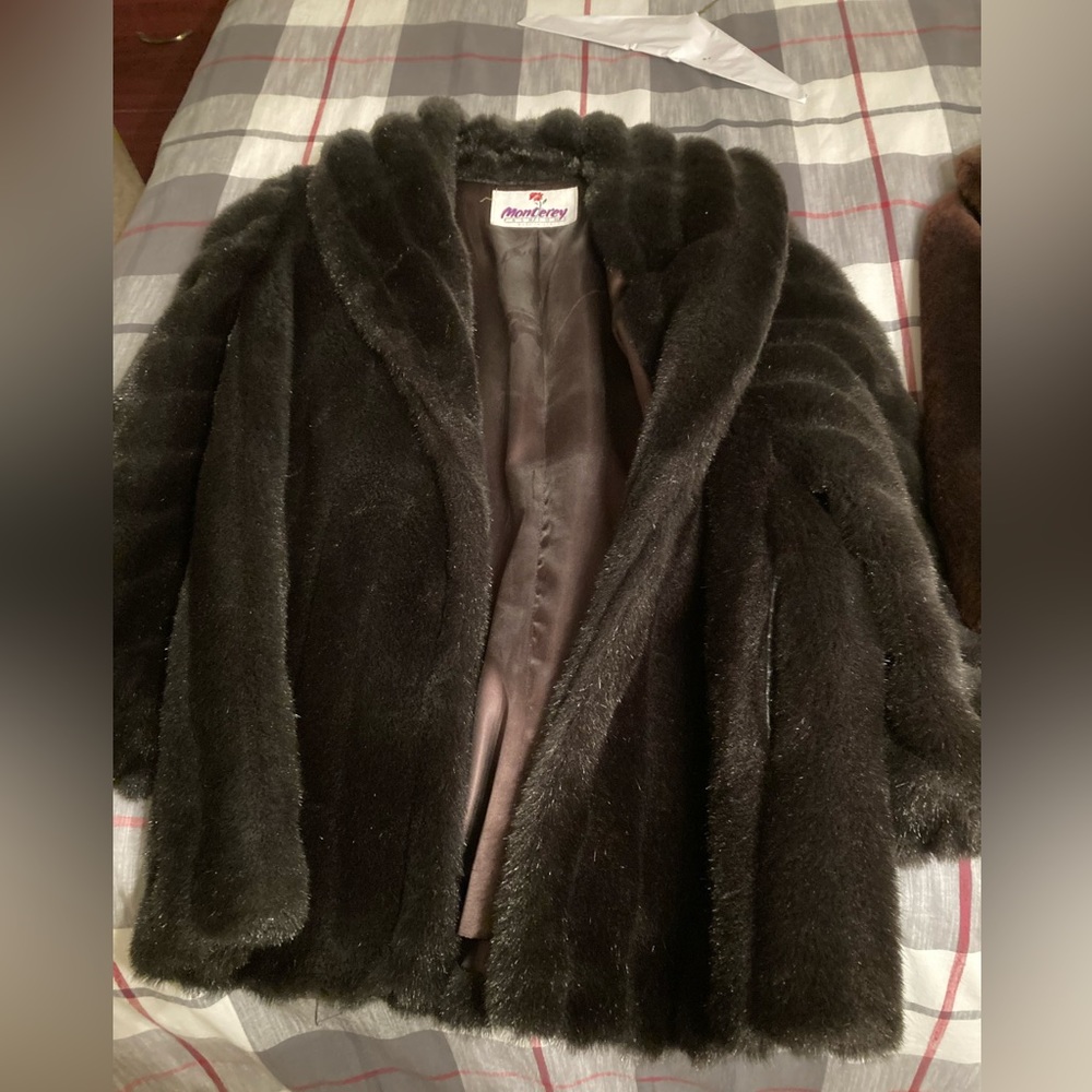 1950’s vintage faux mink coat made in the USA size medium. Great condition.